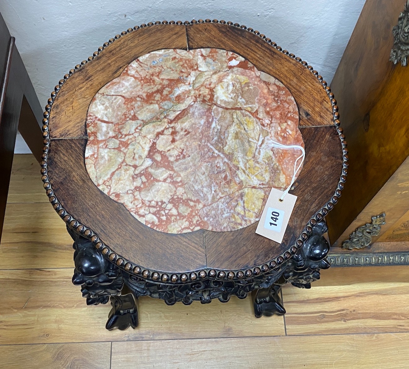A pair of Chinese Hongmu circular marble topped jardiniere stands, diameter 44cm, height 45cm